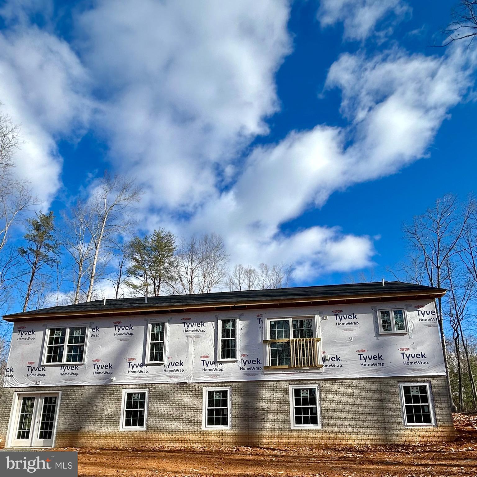 12215 Autumn Ridge Lane Unionville, VA 22567 - Photo 2 of 3 a large building with a lot of windows