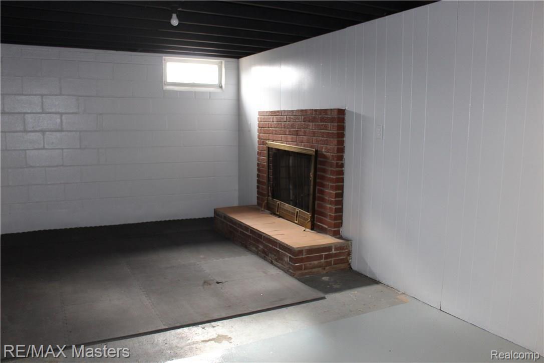 28720 Waltz Road New Boston, MI 48164 - Photo 13 of 18 Basement Fireplace