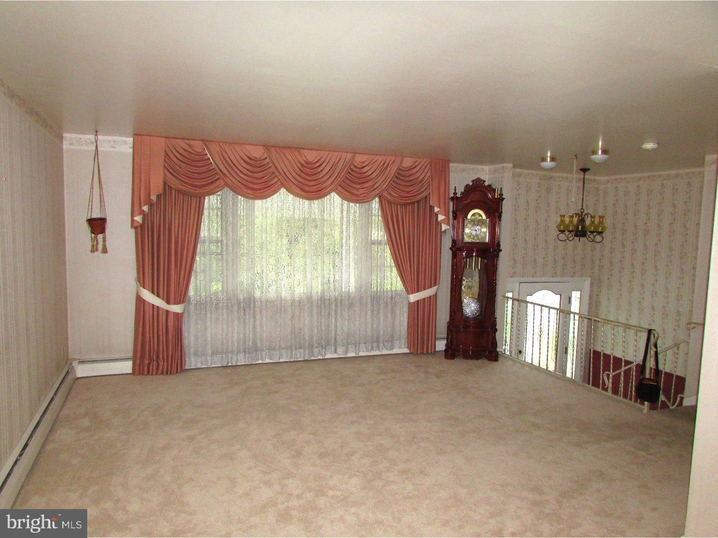 22 North County Line Road Telford, PA 18969 - Photo 5 of 25 a view of an empty room with a fireplace