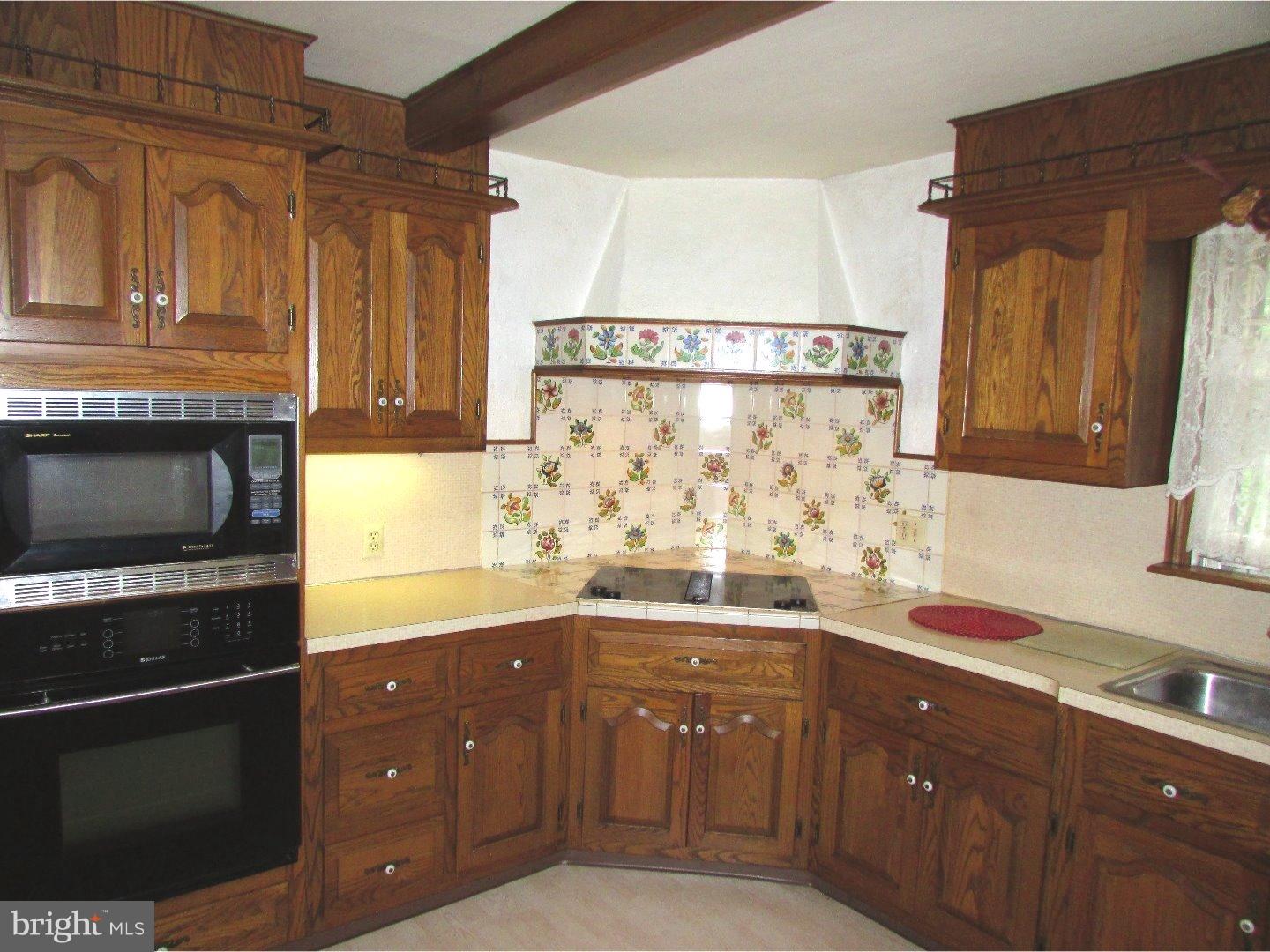 22 North County Line Road Telford, PA 18969 - Photo 7 of 25 a kitchen with a sink and cabinets