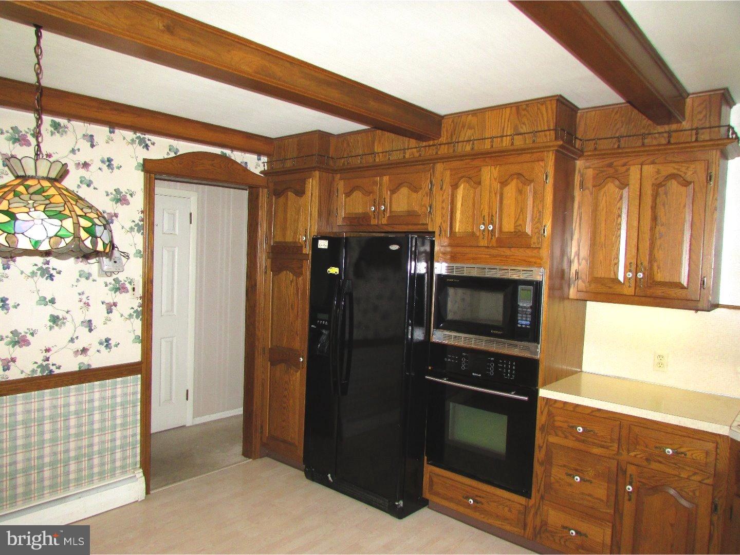 22 North County Line Road Telford, PA 18969 - Photo 8 of 25 a kitchen with stainless steel appliances granite countertop a refrigerator and a stove