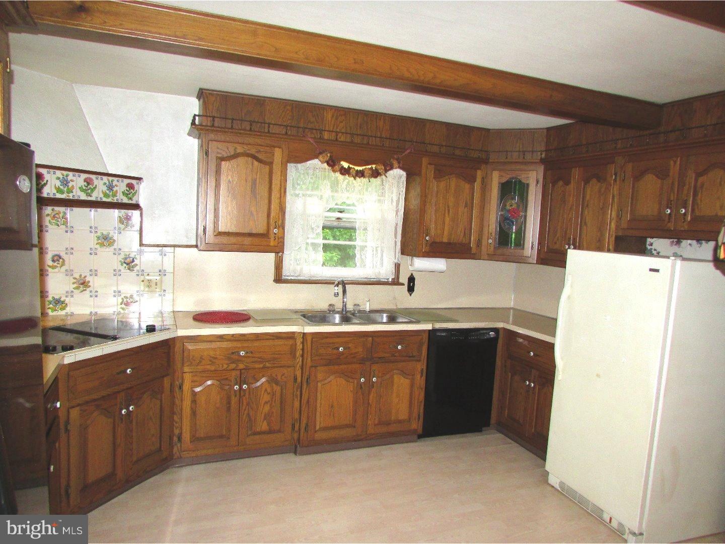 22 North County Line Road Telford, PA 18969 - Photo 9 of 25 a kitchen with a sink and cabinets