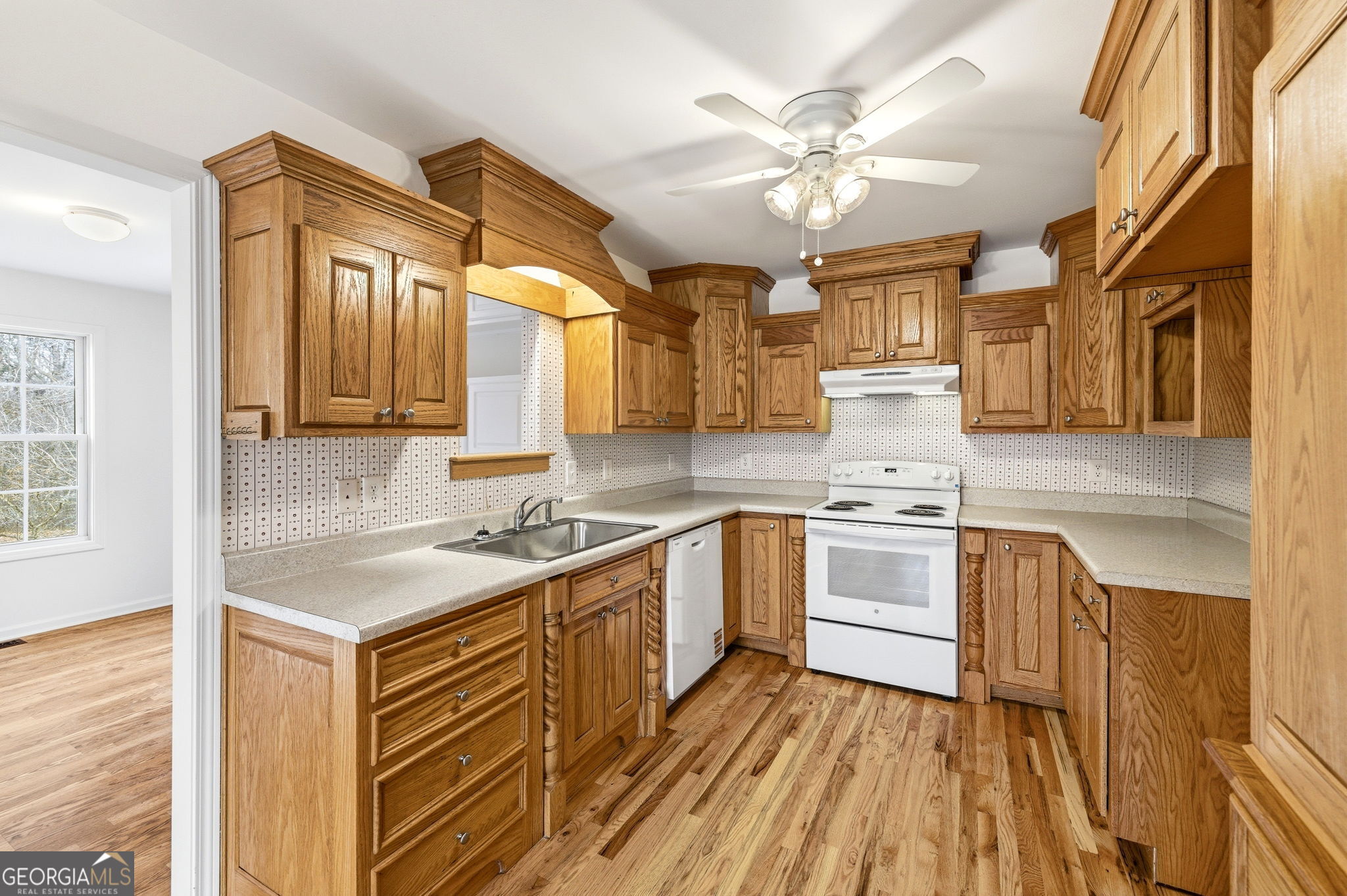 1429 Crumps Bridge Road Martin, GA 30557 - Photo 19 of 54 a kitchen with a sink appliances cabinets and a large window