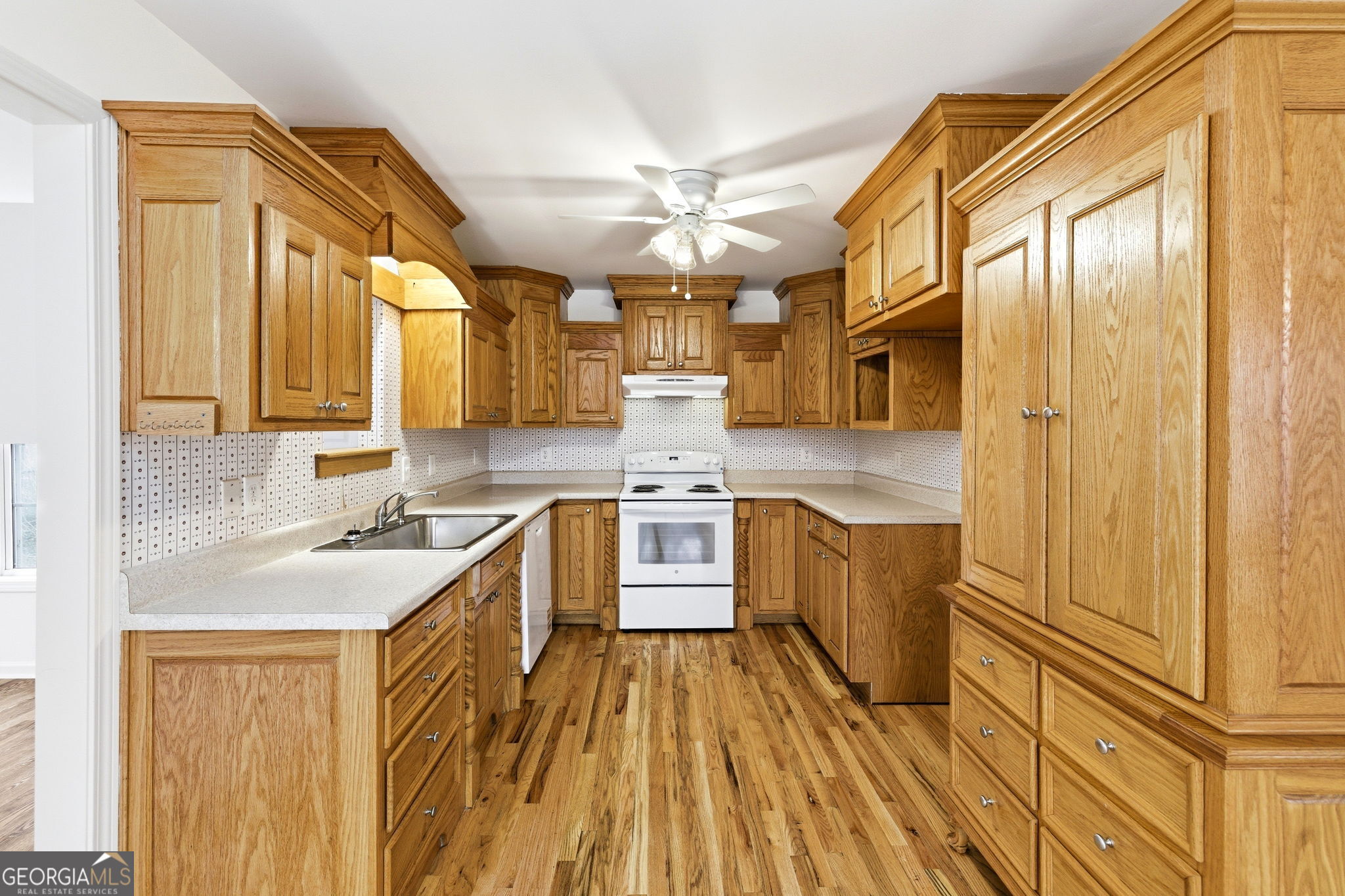 1429 Crumps Bridge Road Martin, GA 30557 - Photo 20 of 54 a kitchen with stainless steel appliances granite countertop a sink stove and refrigerator