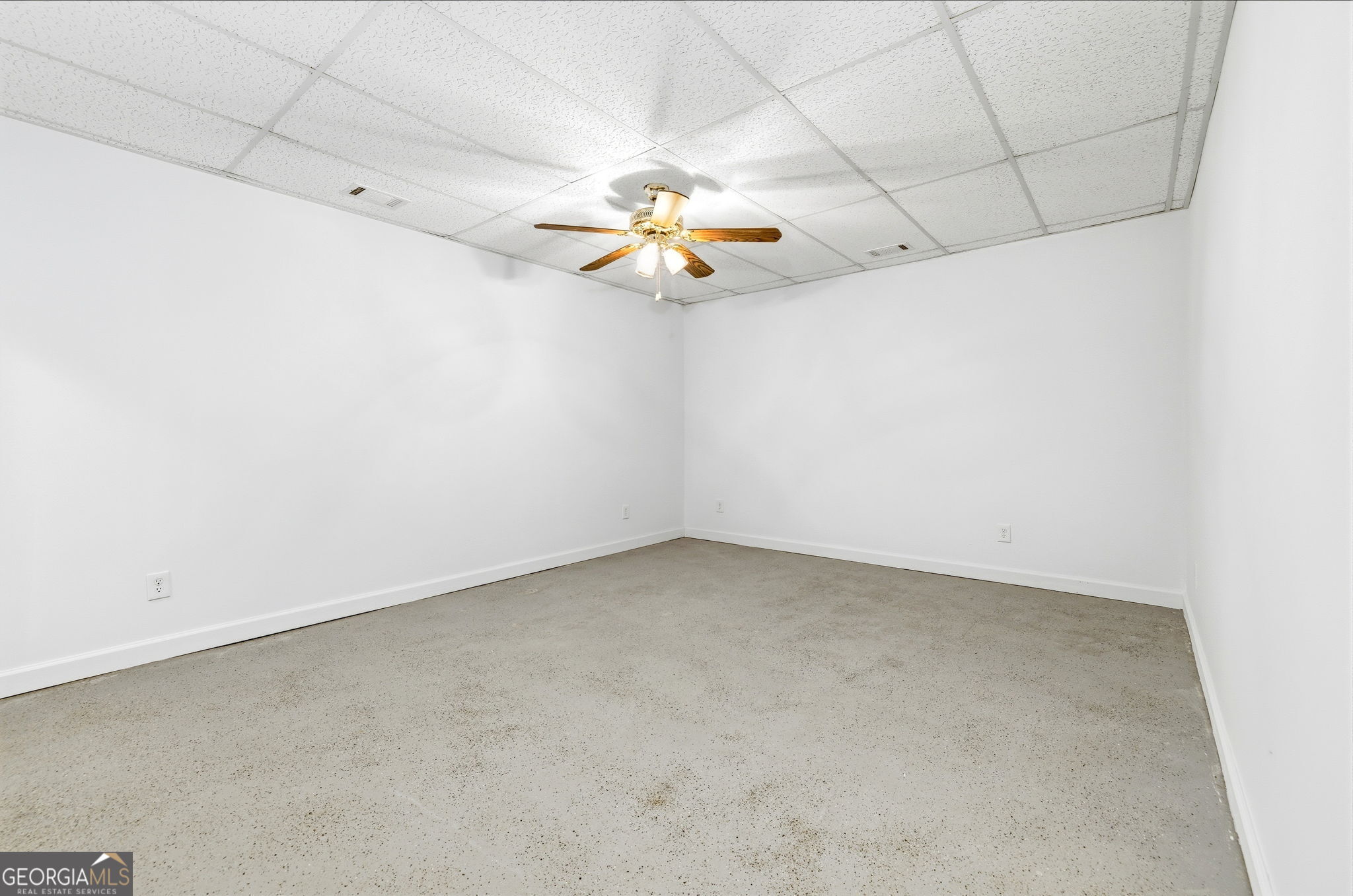 1429 Crumps Bridge Road Martin, GA 30557 - Photo 31 of 54 an empty room with a ceiling fan and carpet