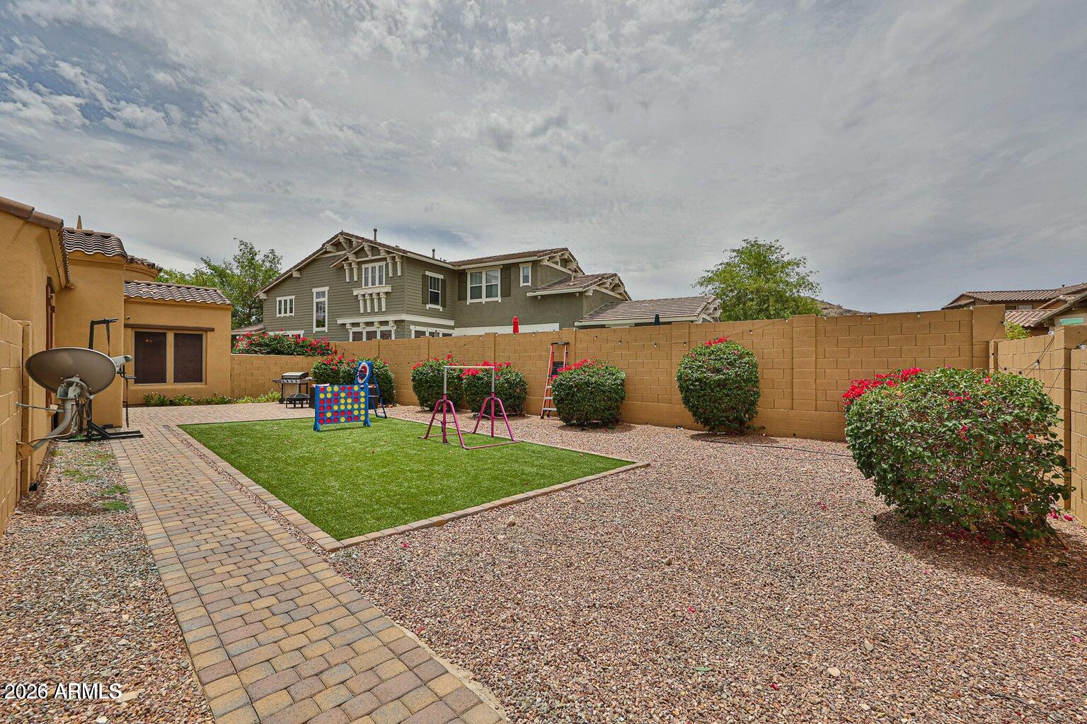 3950 North Edith Way Buckeye, AZ 85396 - Photo 26 of 32 a front view of a house with a yard and garage