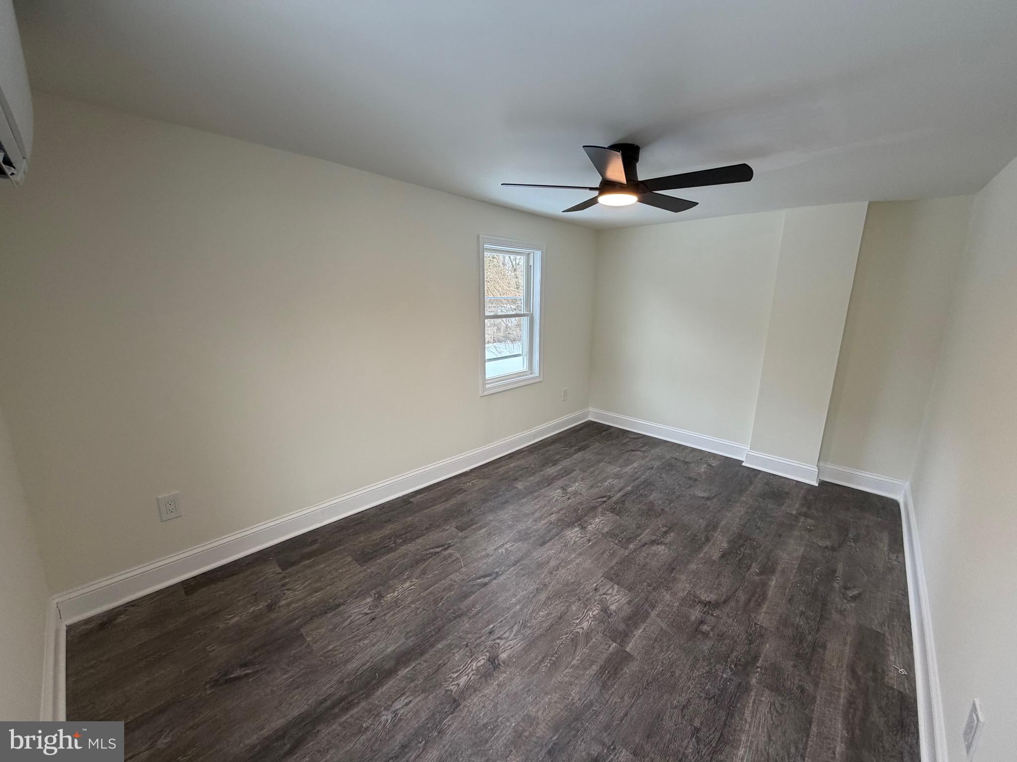 197 Main Street Hartly, DE 19953 - Photo 13 of 17 an empty room with a window and ceiling fan