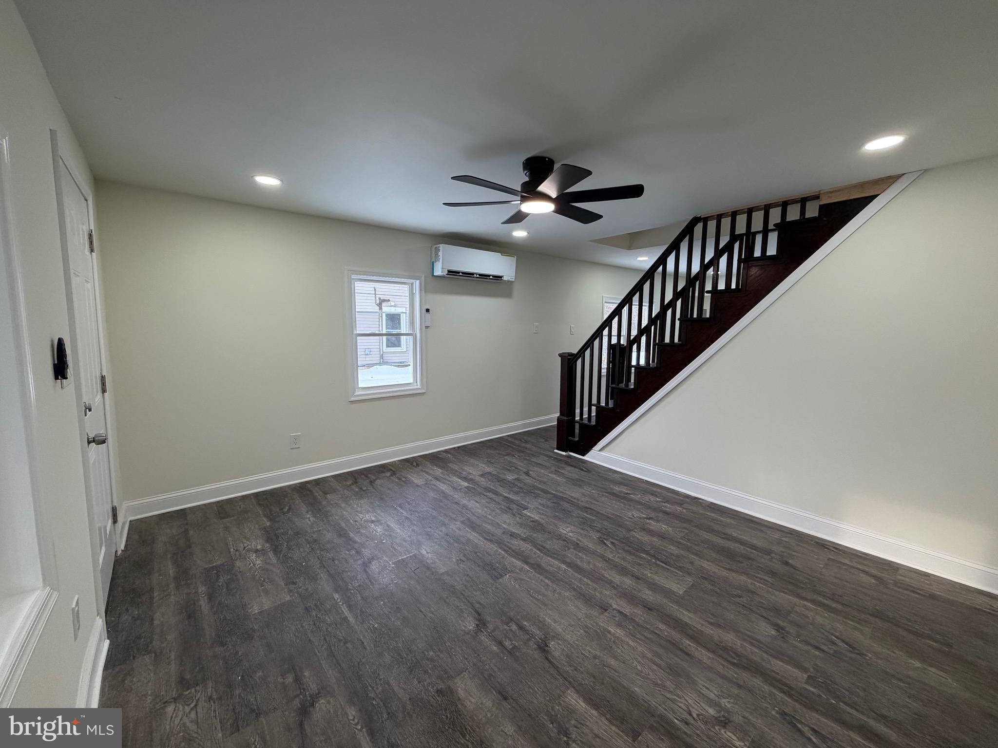 197 Main Street Hartly, DE 19953 - Photo 2 of 17 a view of an empty room with wooden floor and a window