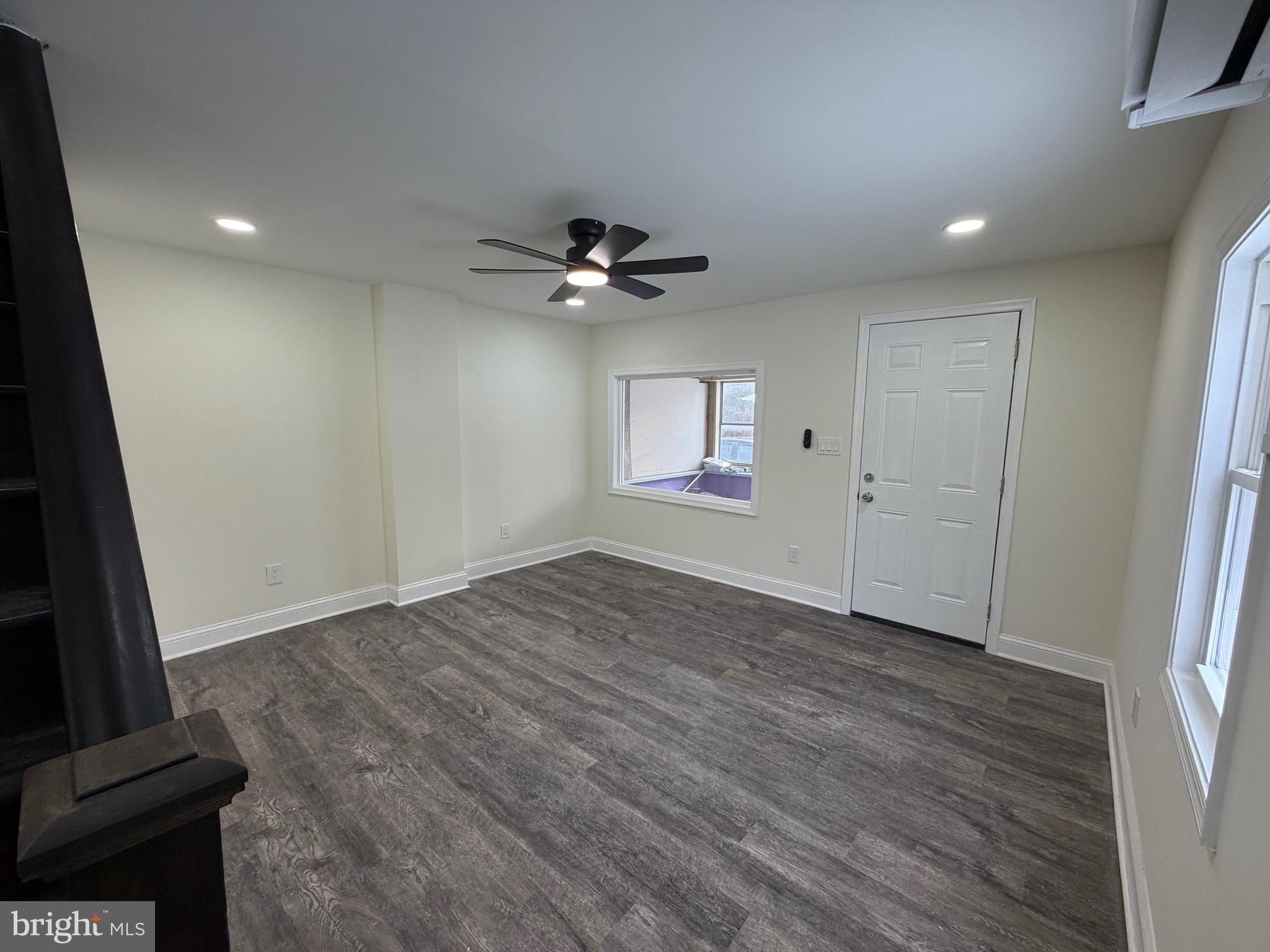 197 Main Street Hartly, DE 19953 - Photo 4 of 17 wooden floor in an empty room with a window