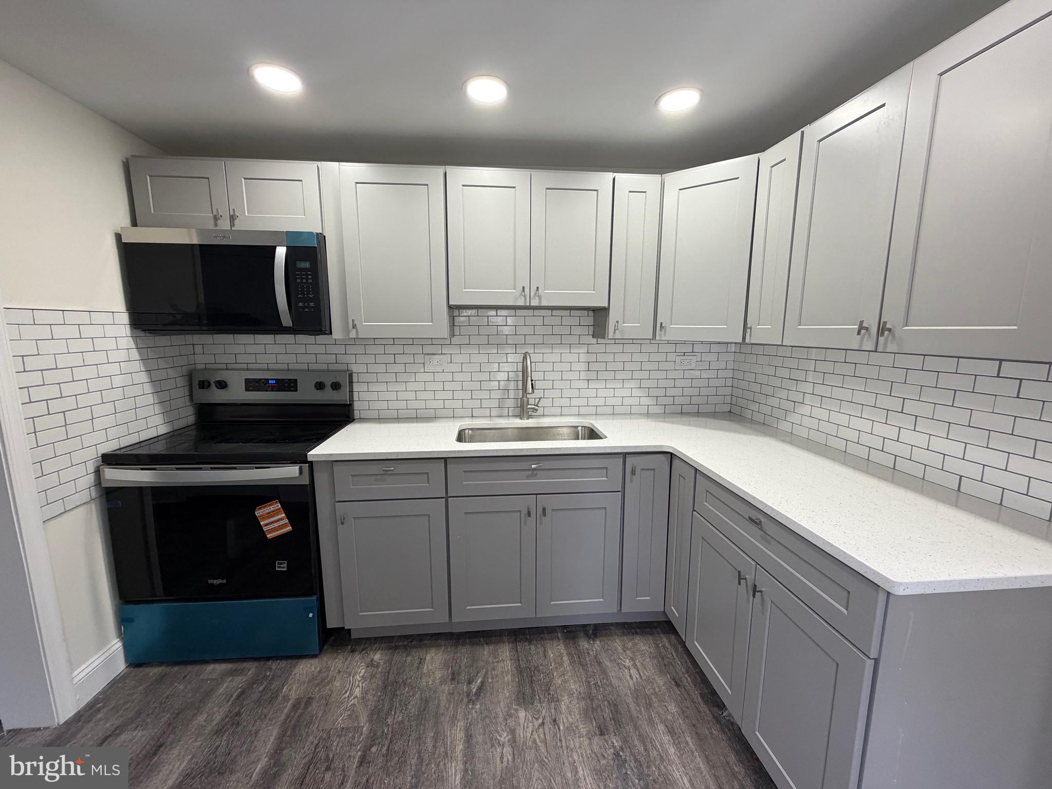 197 Main Street Hartly, DE 19953 - Photo 9 of 17 a kitchen with a sink stove and cabinets