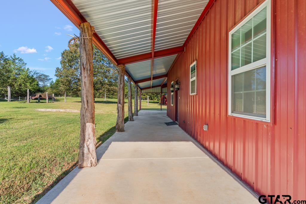 3400 Pony Road Gilmer, TX 75644 - Photo 21 of 46 a view of a porch with a backyard