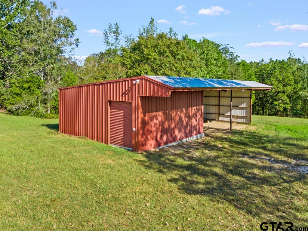 3400 Pony Road Gilmer, TX 75644 - Photo 23 of 46 a view of a house with a yard