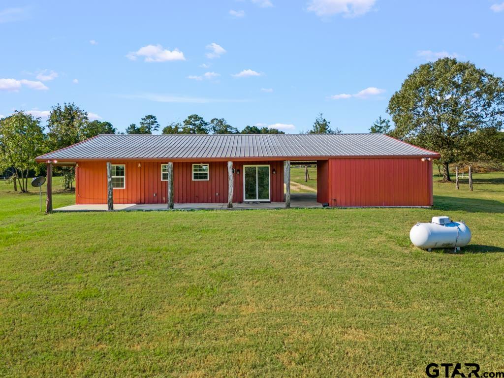 3400 Pony Road Gilmer, TX 75644 - Photo 27 of 46 a front view of a house with garden