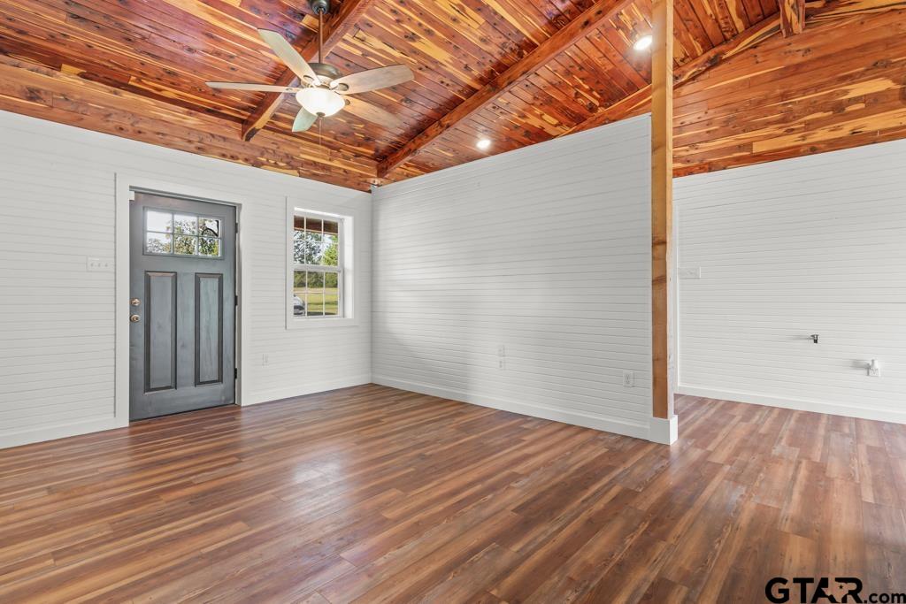 3400 Pony Road Gilmer, TX 75644 - Photo 10 of 46 a view of an empty room with wooden floor