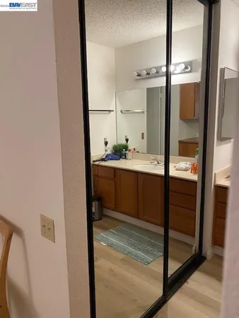 a bathroom with a double vanity sink and mirror