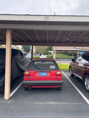 a backyard of a house with barbeque oven table and chairs