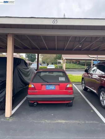 a yellow room with furniture and a swimming pool