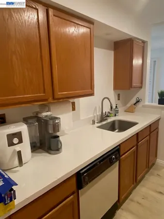 a kitchen with a sink and cabinets