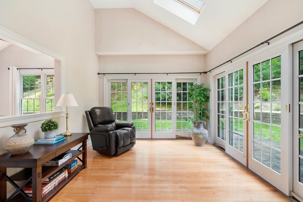 21 Guide Post Pth Path Marshfield, MA 02050 - Photo 12 of 34 a living room with furniture and floor to ceiling windows