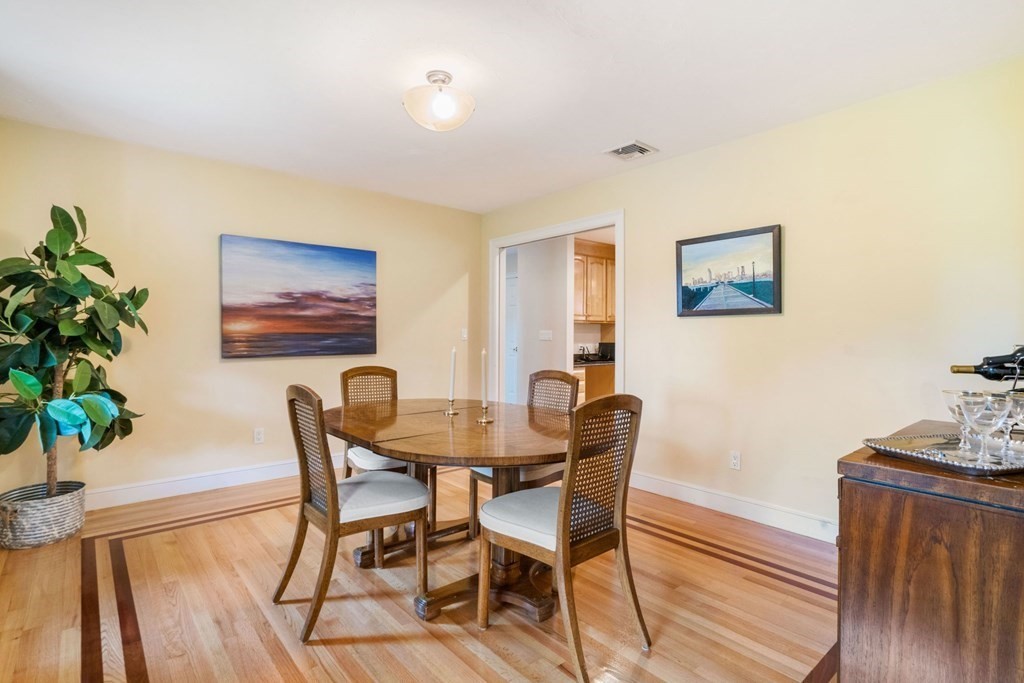 21 Guide Post Pth Path Marshfield, MA 02050 - Photo 15 of 34 a view of a dining room with furniture and wooden floor