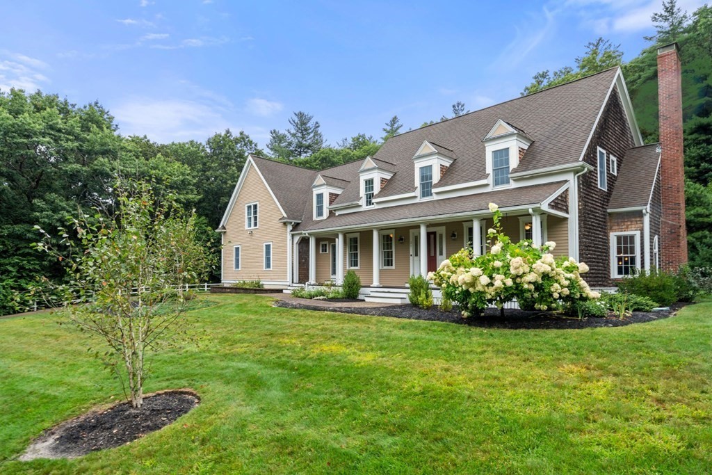 21 Guide Post Pth Path Marshfield, MA 02050 - Photo 2 of 34 a front view of a house with a garden