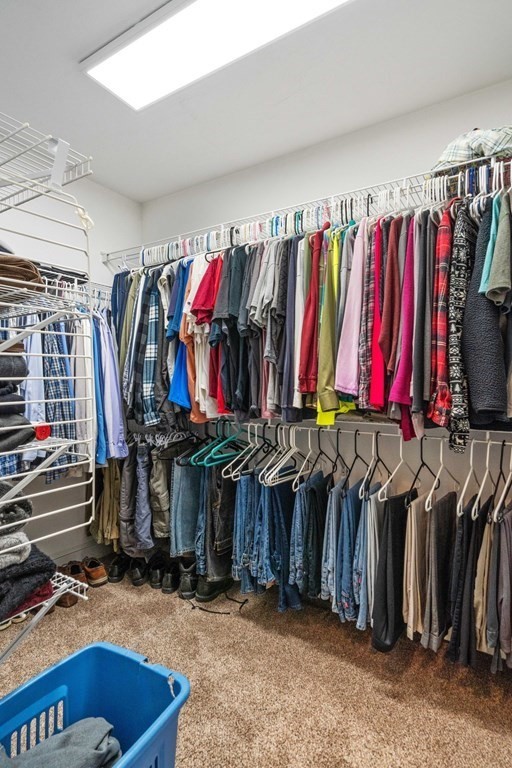 21 Guide Post Pth Path Marshfield, MA 02050 - Photo 24 of 34 a view of walk in closet with clothes