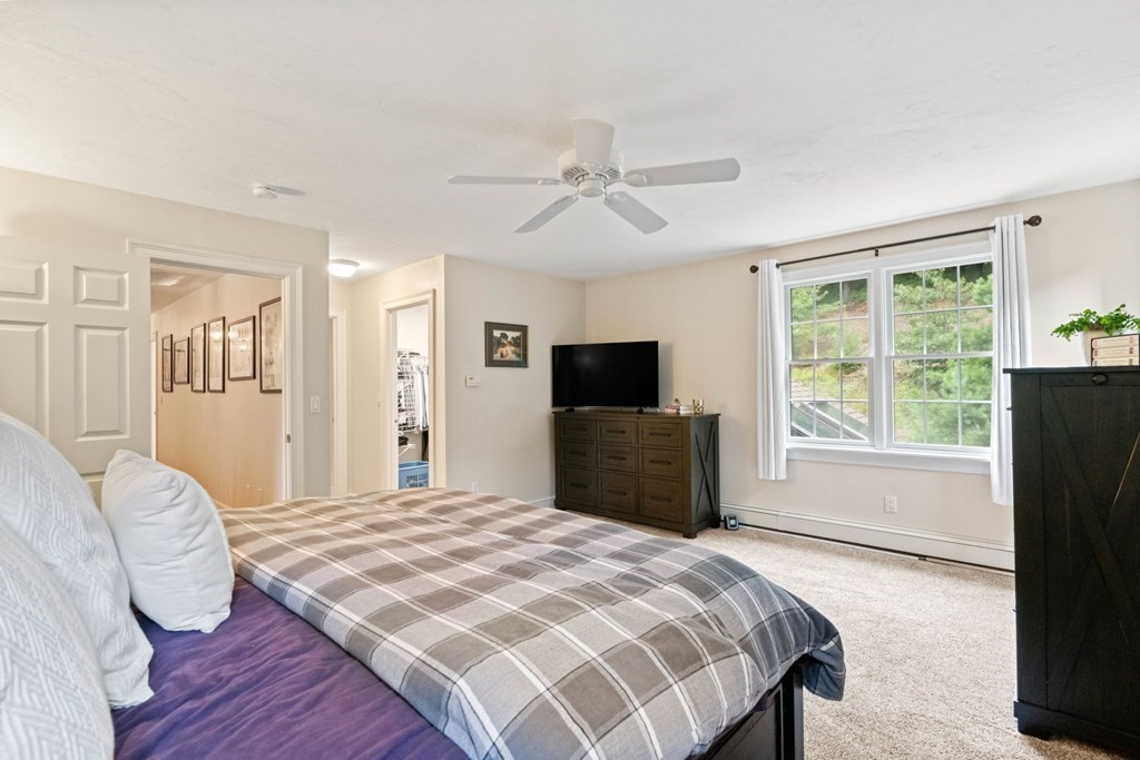 21 Guide Post Pth Path Marshfield, MA 02050 - Photo 25 of 34 a bedroom with a bed a window and a television