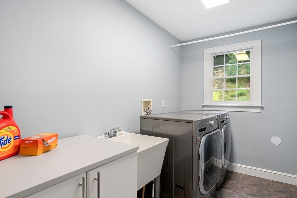 21 Guide Post Pth Path Marshfield, MA 02050 - Photo 29 of 34 a utility room with dryer and washer