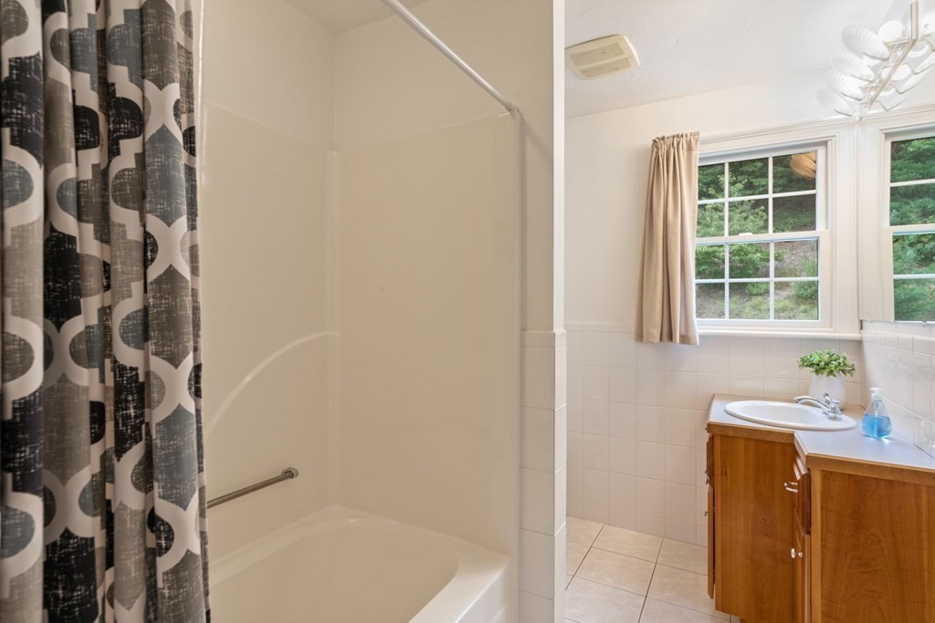 21 Guide Post Pth Path Marshfield, MA 02050 - Photo 30 of 34 a bathroom with a bathtub and shower