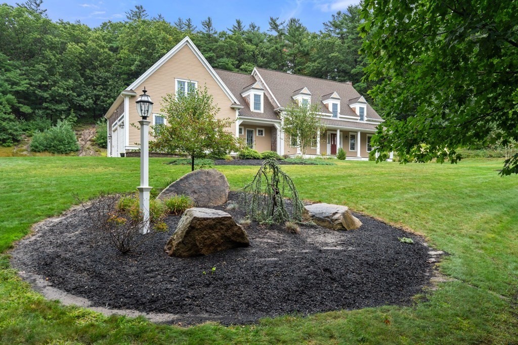 21 Guide Post Pth Path Marshfield, MA 02050 - Photo 31 of 34 a front view of house with a garden and trees