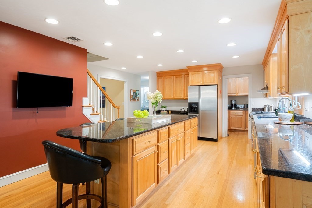 21 Guide Post Pth Path Marshfield, MA 02050 - Photo 6 of 34 a kitchen with stainless steel appliances kitchen island granite countertop a sink and a refrigerator