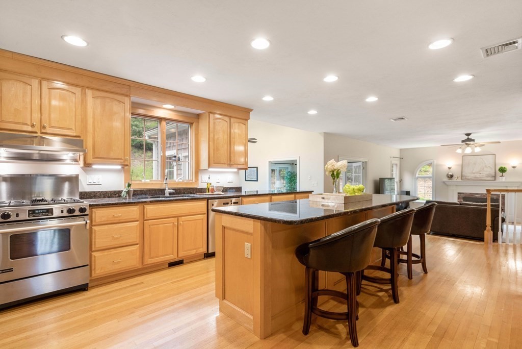 21 Guide Post Pth Path Marshfield, MA 02050 - Photo 8 of 34 a kitchen with stainless steel appliances granite countertop table chairs sink and cabinets
