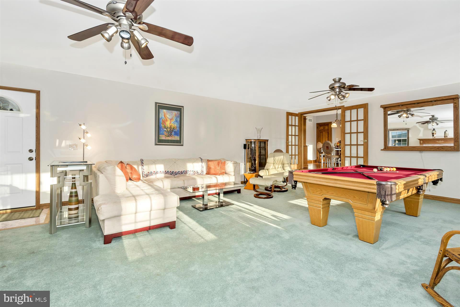 2512 Braddock Road Mount Airy, MD 21771 - Photo 14 of 30 a living room with furniture and a chandelier