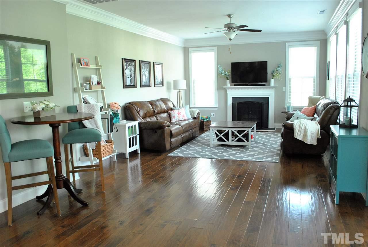 100 Maraketch Court Raleigh, NC 27603 - Photo 11 of 22 a living room with fireplace furniture and a flat screen tv
