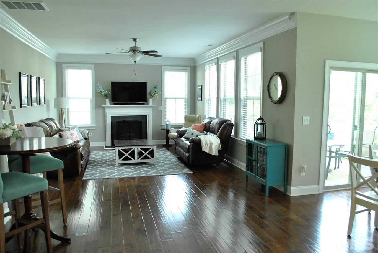 100 Maraketch Court Raleigh, NC 27603 - Photo 12 of 22 a living room with furniture a flat screen tv and a fireplace