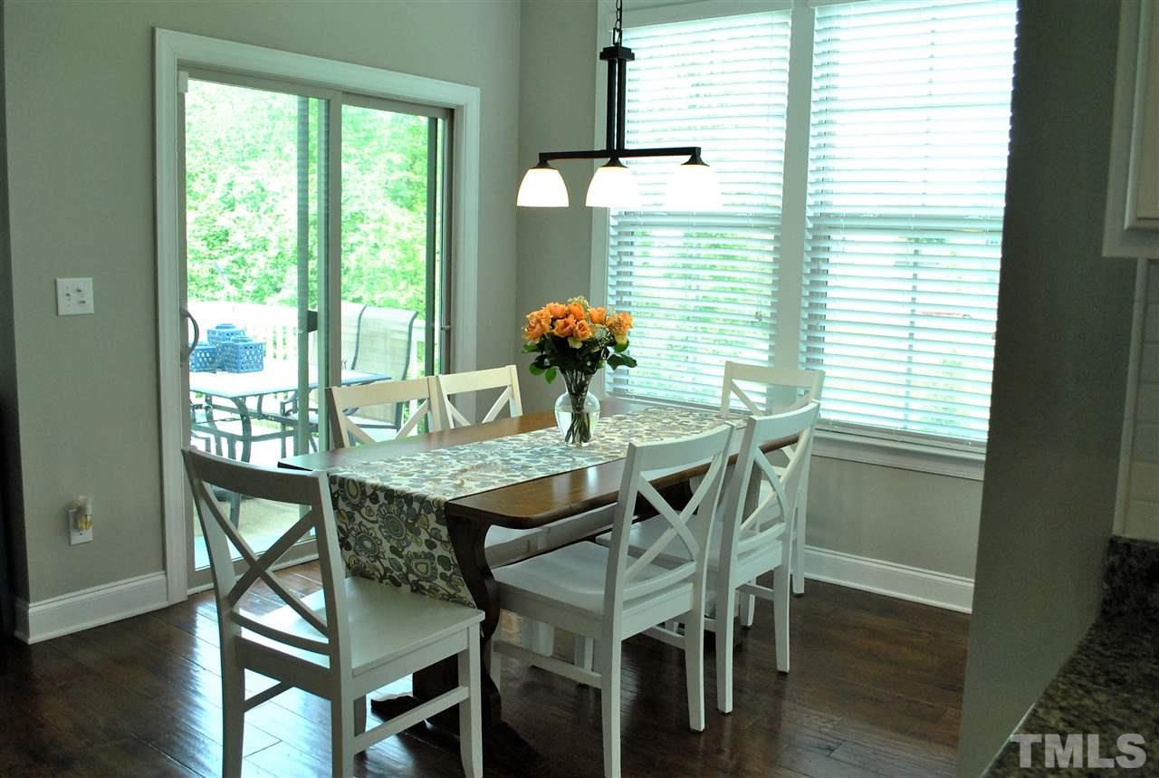 100 Maraketch Court Raleigh, NC 27603 - Photo 13 of 22 a dining room with furniture and wooden floor