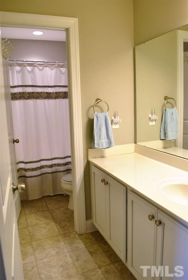 100 Maraketch Court Raleigh, NC 27603 - Photo 15 of 22 a bathroom with a sink and a mirror