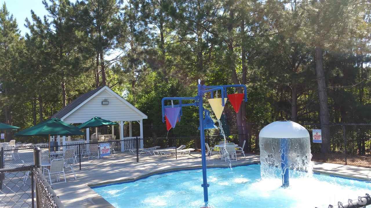 100 Maraketch Court Raleigh, NC 27603 - Photo 20 of 22 a view of a chairs and table under an umbrella