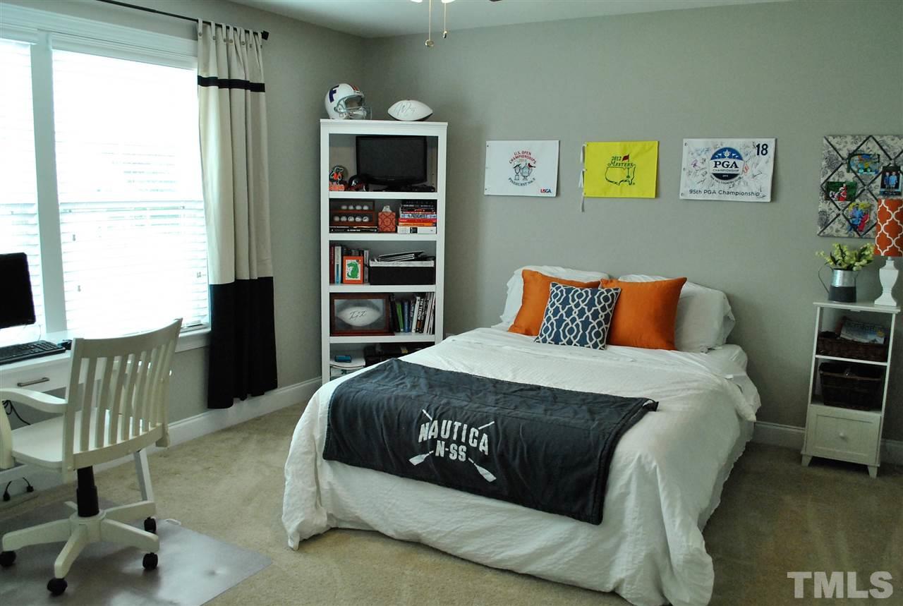 100 Maraketch Court Raleigh, NC 27603 - Photo 5 of 22 a bedroom with a bed window and wall painting