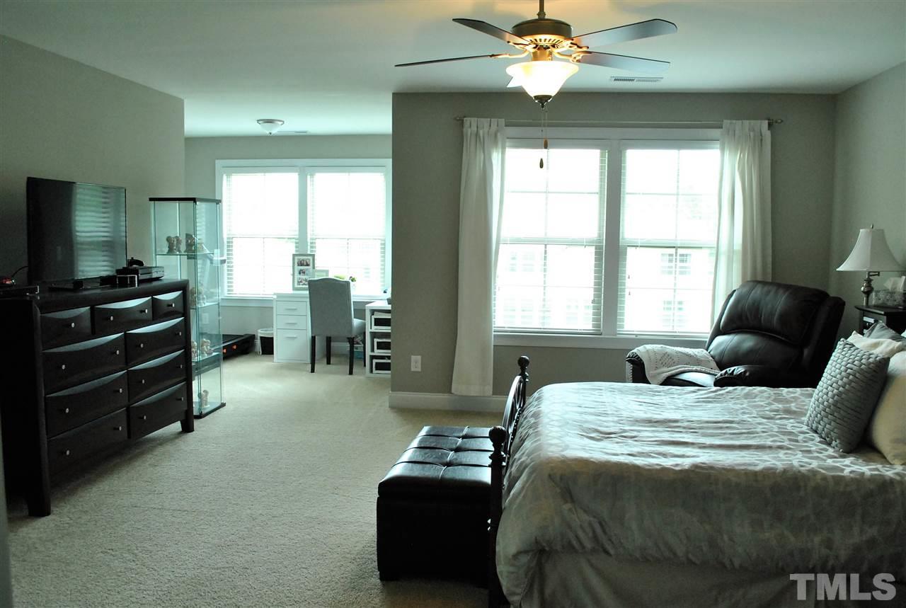 100 Maraketch Court Raleigh, NC 27603 - Photo 10 of 22 a bedroom with furniture and a large window