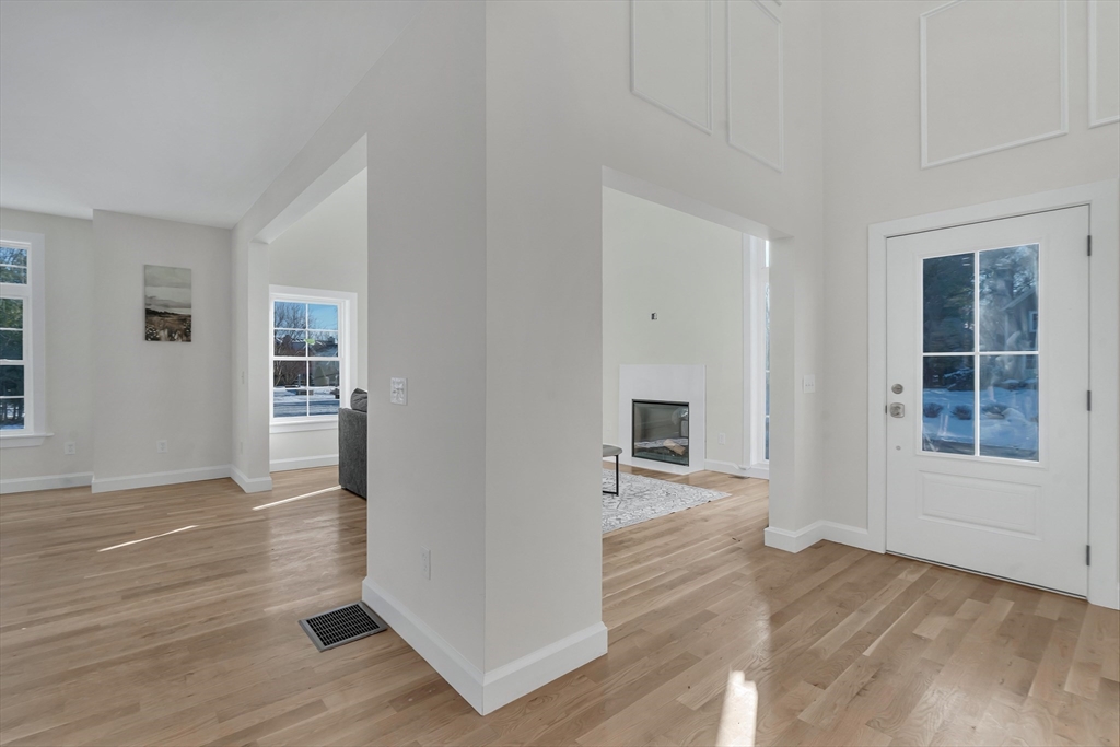 25 Columbine Road Rehoboth, MA 02769 - Photo 14 of 42 an empty room with wooden floor and windows