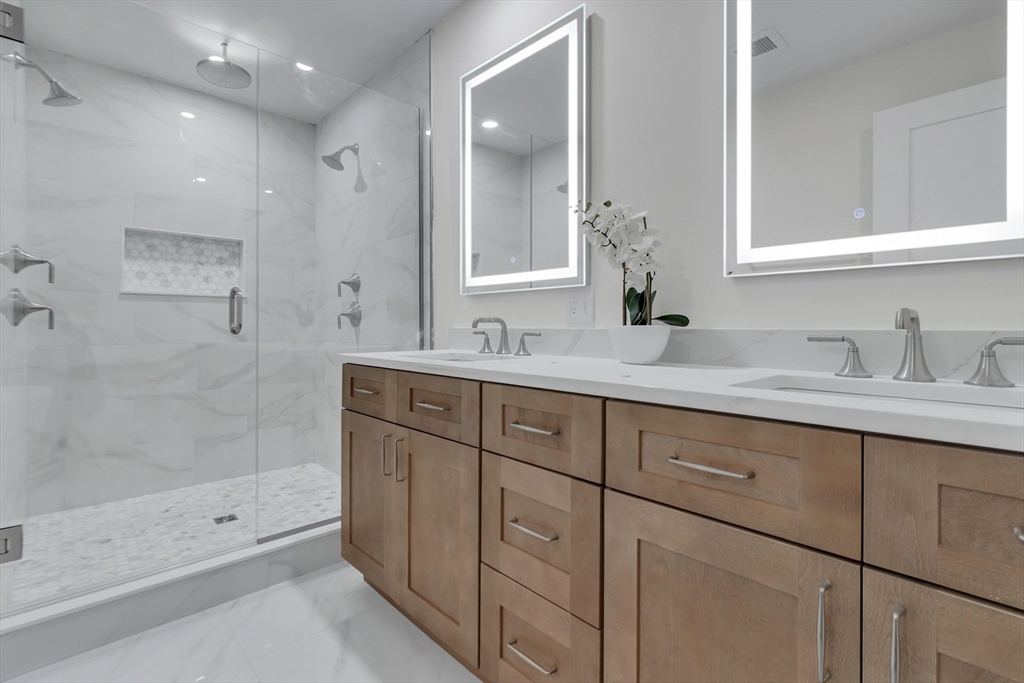 25 Columbine Road Rehoboth, MA 02769 - Photo 22 of 42 a bathroom with double sink and a mirror