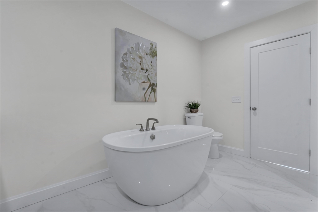 25 Columbine Road Rehoboth, MA 02769 - Photo 23 of 42 a white bath tub sitting next to a white sink