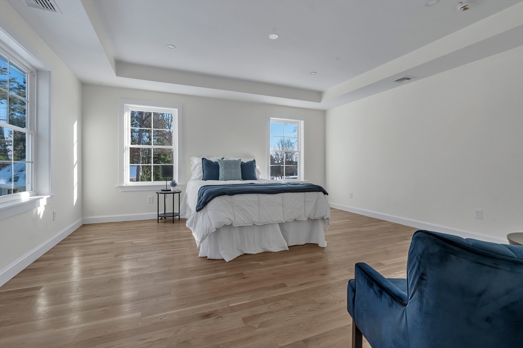 25 Columbine Road Rehoboth, MA 02769 - Photo 26 of 42 a bedroom with a bed and wooden floor