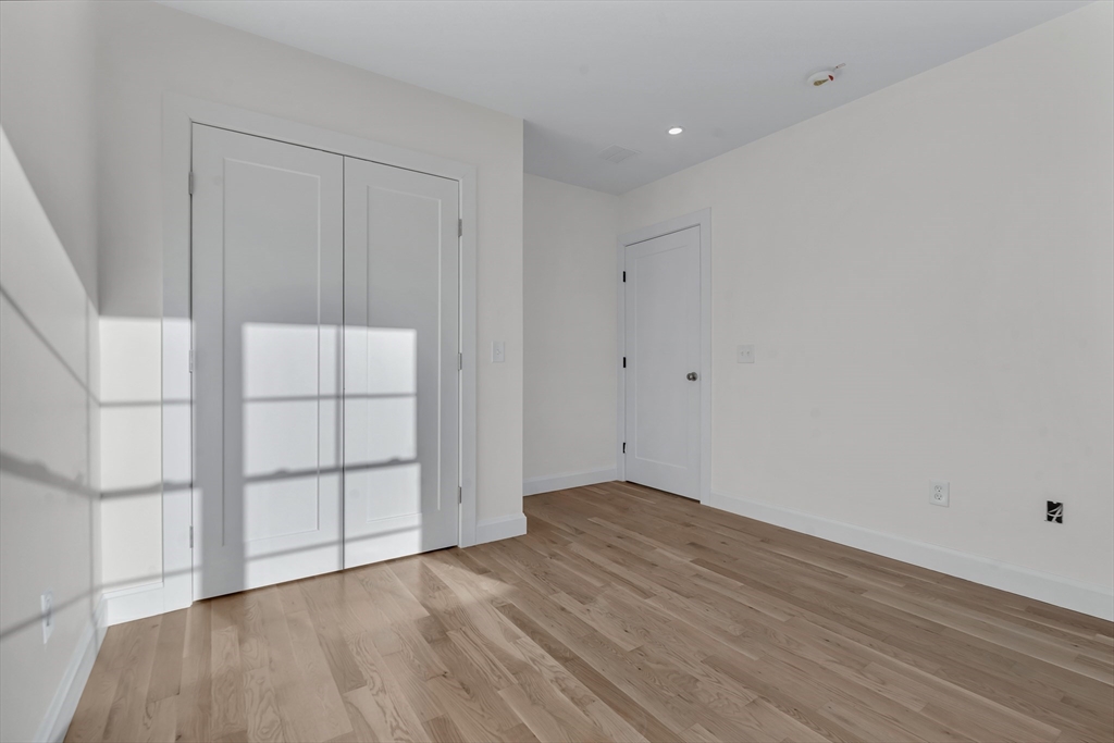 25 Columbine Road Rehoboth, MA 02769 - Photo 29 of 42 wooden floor in an empty room with a window