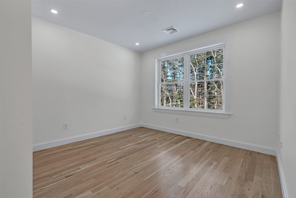 25 Columbine Road Rehoboth, MA 02769 - Photo 30 of 42 an empty room with wooden floor and windows