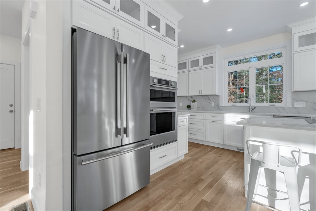 25 Columbine Road Rehoboth, MA 02769 - Photo 3 of 42 a kitchen with stainless steel appliances a refrigerator sink and cabinets