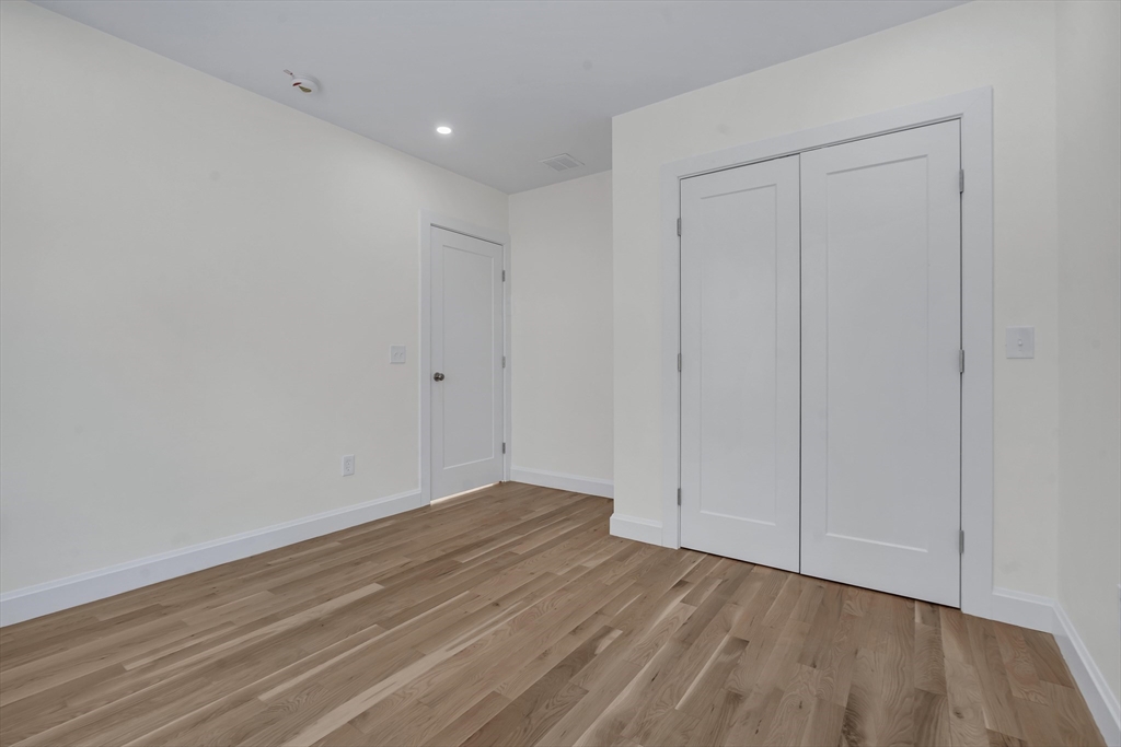 25 Columbine Road Rehoboth, MA 02769 - Photo 31 of 42 a view of an empty room with wooden floor