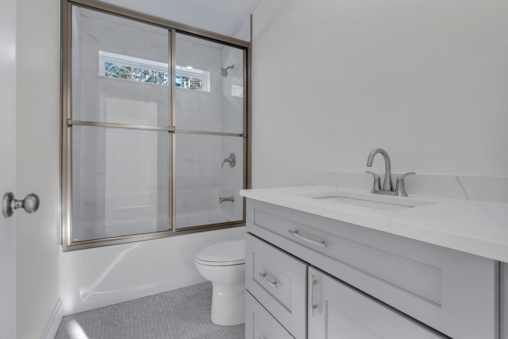 25 Columbine Road Rehoboth, MA 02769 - Photo 32 of 42 a bathroom with a sink a toilet and shower