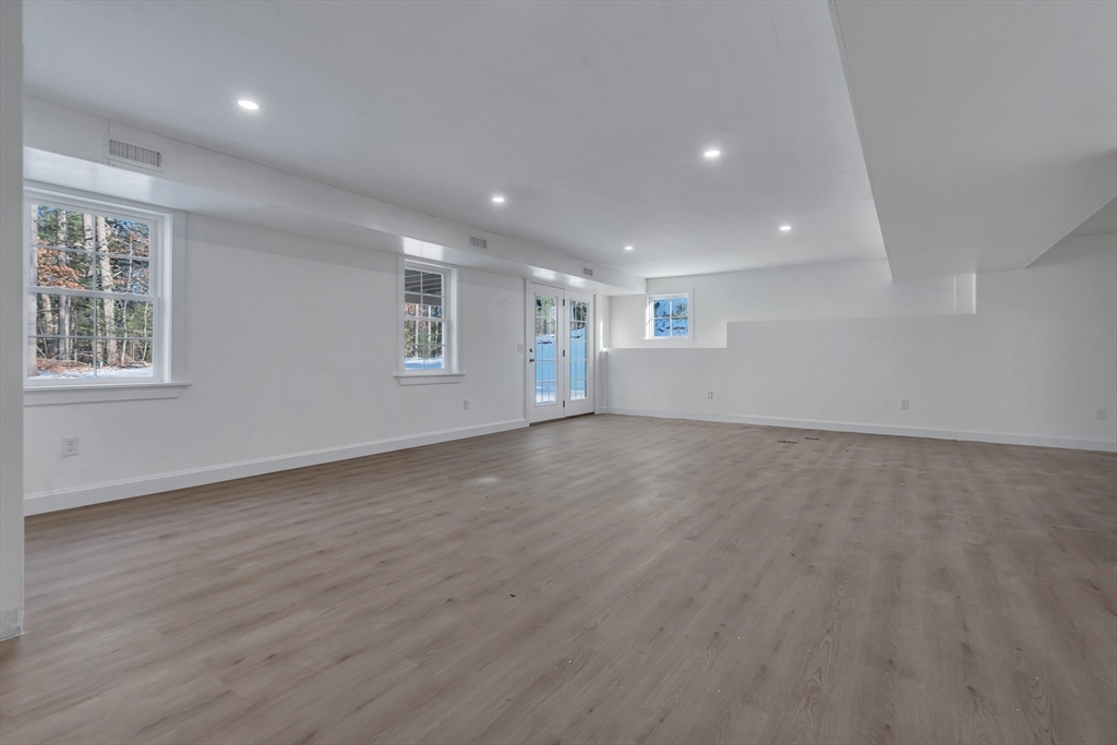 25 Columbine Road Rehoboth, MA 02769 - Photo 34 of 42 an empty room with wooden floor and windows